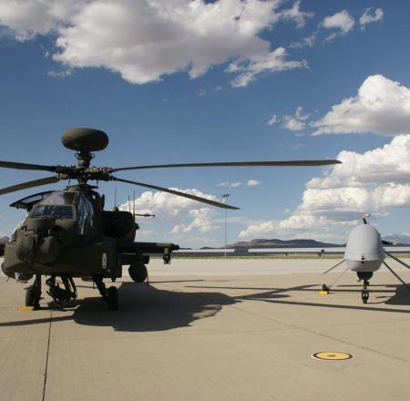 An MQ MQ-1C Gray Eagle, shown here alongside an Apache helicopter. New program starts in the manned-unmanned teaming arena make up 8 percent of the fiscal 2020 budget request. Photo: General Atomics Aeronautical Systems