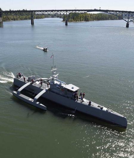 Sea Hunter, a medium-sized USV, gets underway on the Williamette River, Portland, Oregon, 2017, following a christening ceremony. The Navy would like more USVs of all sizes. Photo: U.S Navy/John F. Williams