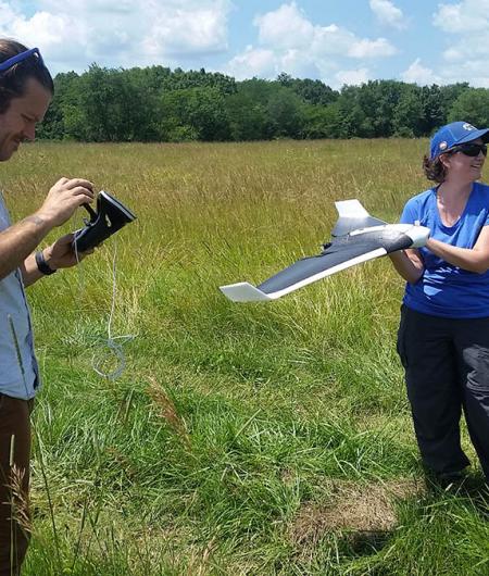 Dr. Holly Jones works with a drone to study a 4,000 acre prairie. Photo: Parrot