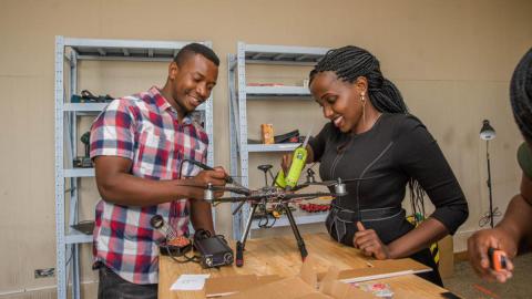 ADDA students Hope Chilunga (left) and Anne Nderitu attach a sensor to a drone. Photo: UNICEF/Moving Minds Multimedia