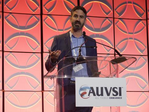 The Defense Innovation Unit's Orin Hoffman discusses DIU at AUVSI's Defense. Protection. Security conference in 2018. Photo: AUVSI