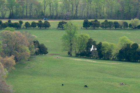 An AeroVironment Puma flies over Virginia farmland. Photo: MAAP