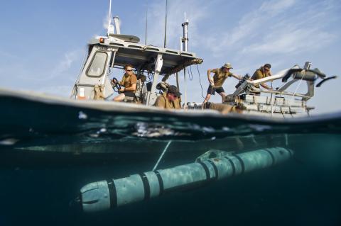 A Mk 18 Mod 2 UUV is launched from a boat in a mine detection demonstration. Photo: U.S. Navy